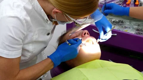 The dentist performs anesthesia before placing the filling Stock Footage 168640539