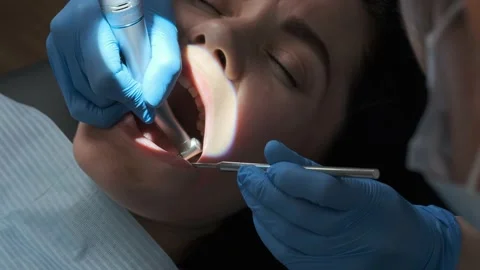 Dentist performs dental procedure  Video stock 201971378