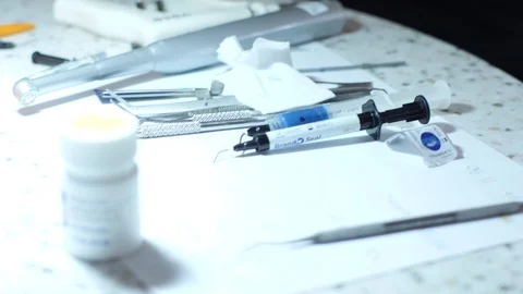 Dentist Picks Up Tool Stock Footage 86579739