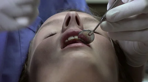 Dentist practice a surface anesthesia Stock Footage 53023436