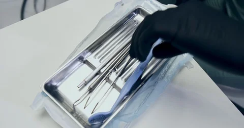 Dentist prepare tool to work. Frame in dentistry nurse prepares the tools Video stock 129610876