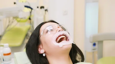 The dentist put the bite block cushion in the patient's mouth Stock Footage 112532157