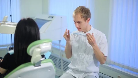 Dentist puts on face mask Stock Footage 73935328