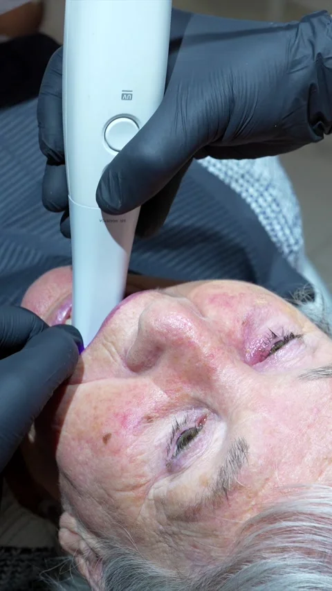 Dentist scanning elderly woman's teeth with intraoral scanner Stock Footage 306061166