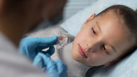 Dentist showing how to use teeth retainers for child, close-up. Orthodontis.. Stock Footage 289829089