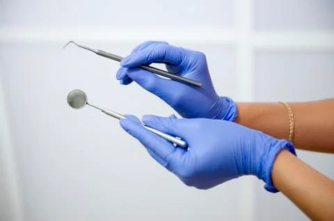Dentist showing tools Stock Photos