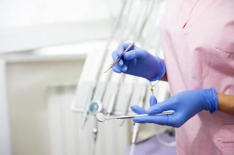 Dentist showing tools Stock Photos