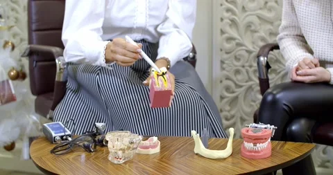 Dentist shows dental problems with examples Stock Footage 149003124