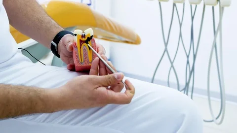 The dentist shows how a broken teeth with caries, a lesson Stock Footage 104292010