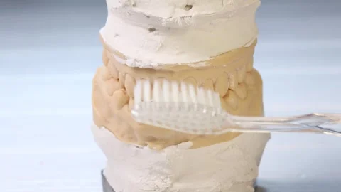 Dentist shows how to properly brush the teeth Stock Footage 280664012