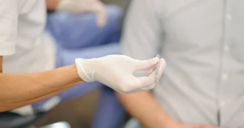 Dentist taking dental tools during a medical treatment Stock Footage 147885685
