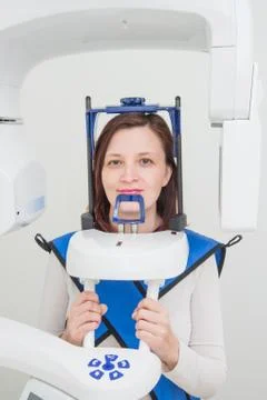 Dentist taking a panoramic digital X-ray of a patients teeth Stock Photos