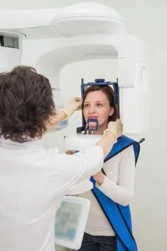 Dentist taking a panoramic digital X-ray of a patient s teeth Stock Photos