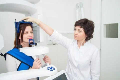 Dentist taking a panoramic digital X-ray of a patient s teeth Stock Photos