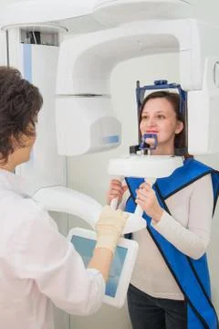 Dentist taking a panoramic digital X-ray of a patient s teeth Stock Photos