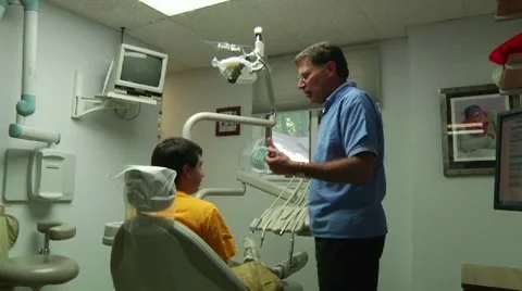 Dentist talking to Patient Stock Footage 8653083