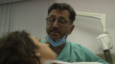 Dentist talks to patient Stock Footage 113189423