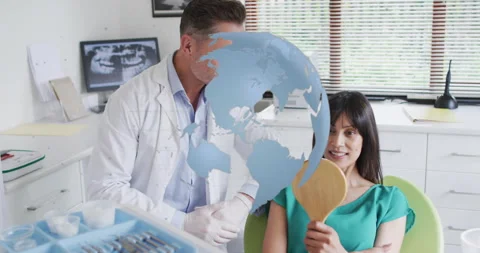 Dentist tapping mirror guiding patient inspecting teeth for viewing x-ray images Stock Footage 316097727