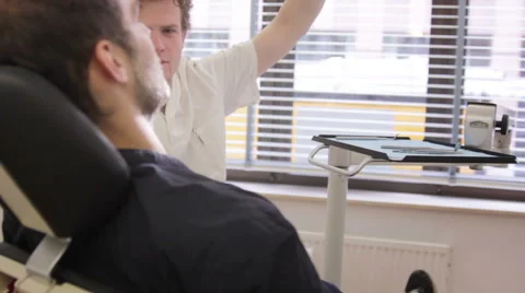 Dentist treating patient Stock Footage 41385009