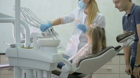 A dentist is treating the teeth to the child. Stock Footage 83136087