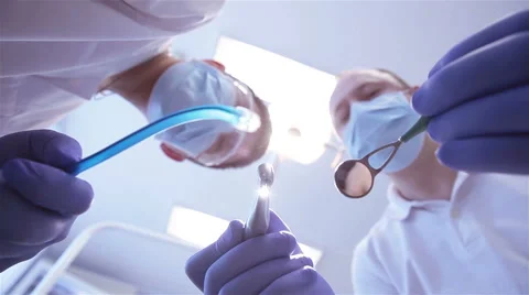 Dentist treats teeth Stock Footage 60049660