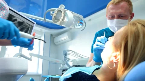 Dentist treats teeth Stock Footage 62711528