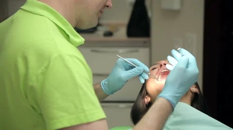 Dentist treats teeth Stock Footage 63313625