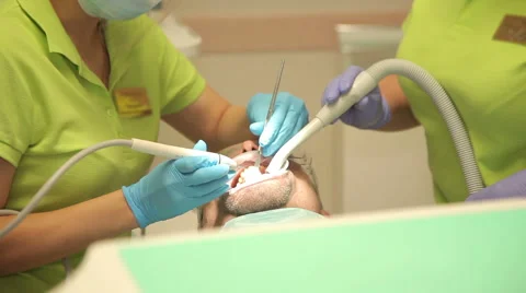 Dentist treats teeth Stock Footage 63315932