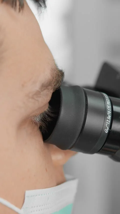 A dentist uses a dental microscope to perform precise and reliable dental Stock Footage 270212502