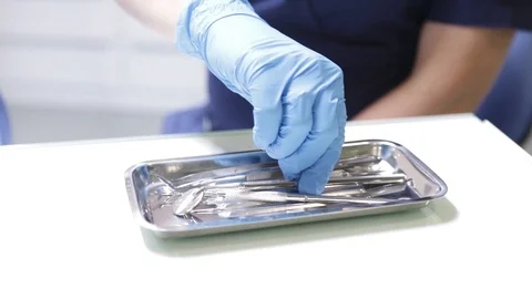 Dentist uses tools during dental treatment Stock Footage 120667106