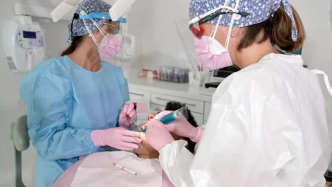 Orthodontist Applying Uv Light Cure Orthodontic Stock Footage
