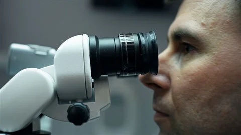 Dentist Using The Microscope Stock Footage 75564993