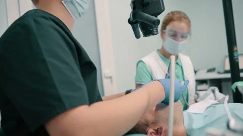 Dentist using microscope. Stock Footage 195003212