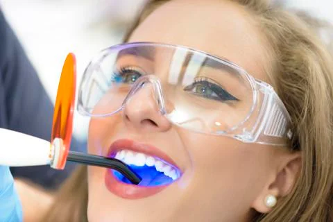 Dentist Using Ultraviolet Lamp Stock Photos