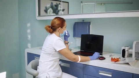 Dentist working on computer Stock Footage 81180579