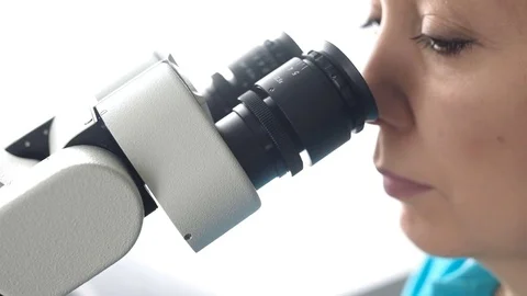 Dentist working with a microscope in laboratory conditions. Video stock 74584897
