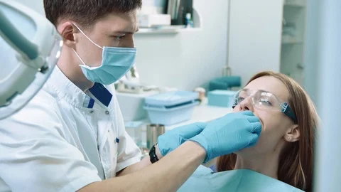 Dentist working with patient Stock Footage 91906353
