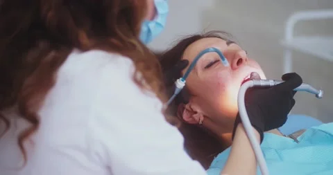 Dentist working on patients teeth 動画素材 155936638