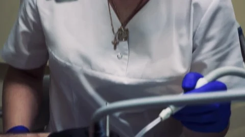 Dentist works with four hands Stock Footage 128711342