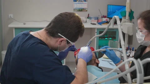 Dentistry Doctors Treating Patients Teeth With Dental Care Tools At Clinic Stock Footage 200872603