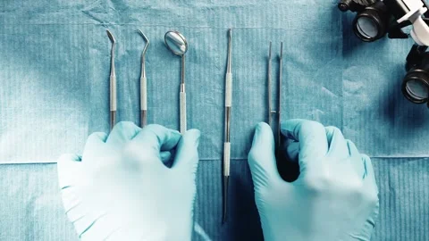 Dentistry Instruments Being Organized on a Blue Surgical Dental Tray Setup 库存影片 331110477