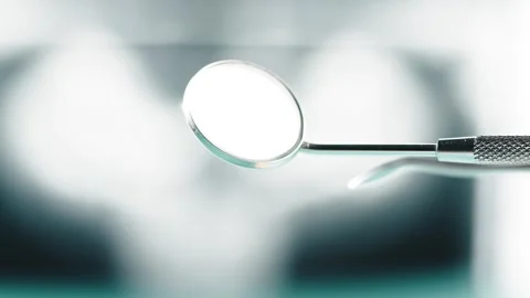 Dentistry Mirror Held by Professional During Oral Examination in Clinic 库存影片 331110487