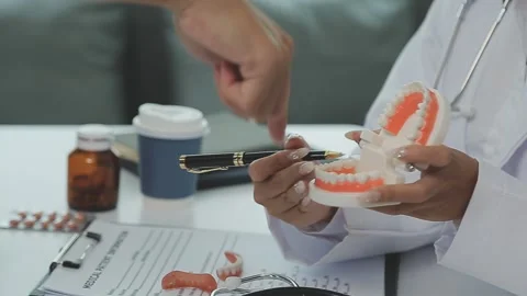Dentists are discussing dental problems at report x-ray image on laptop scr.. Stock Footage 249103621