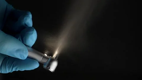 Dentist's hand with drill illustrates work of dental drill 库存影片 237691991