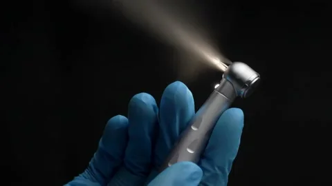Dentist's hand with drill illustrates work of dental drill 스톡 동영상 237692244