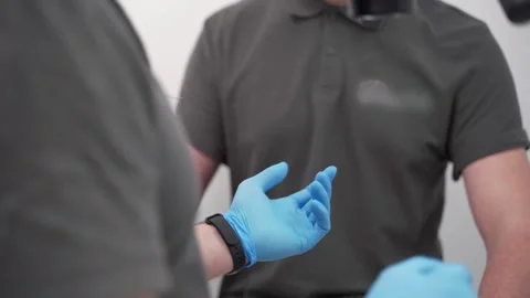 Dentist's hand taking instrument from assistant during operation in modern Stock Footage 264972648