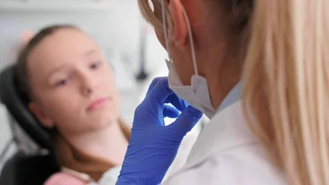 Dentist's hand using dental mirror during checkup 스톡 동영상 106977792