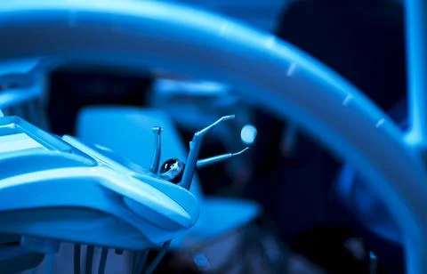 Dentist's instruments with shallow depth of field blue tinted Stock Photos