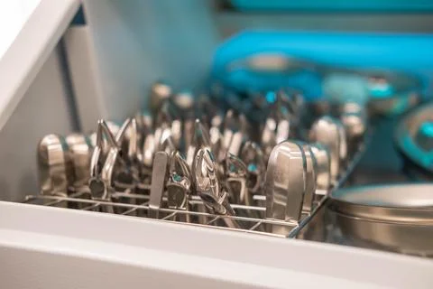 Dentist's instruments in the sterilizer. Various iron tools used in dentistry to Stock Photos