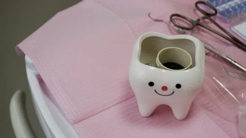 Dentist's tools and equipments in a pink tablecloth Video stock 187691101